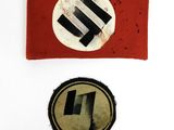 two pieces of red cloth with black and white symbols on them