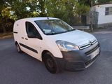 a white van that is parked on the side of the road