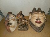 three masks that are sitting on a table