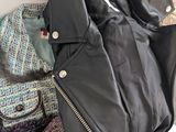 a pile of clothes and a jacket on the floor