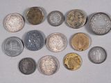 a lot of coins that are on the table
