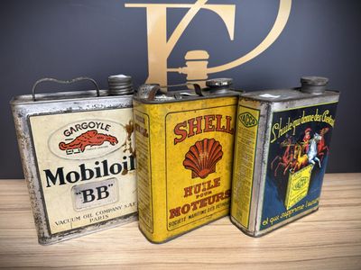 three tins that are sitting on a table