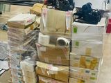 a lot of boxes and boxes on a cart in a warehouse