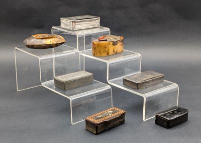 five boxes stacked on top of each other on a table