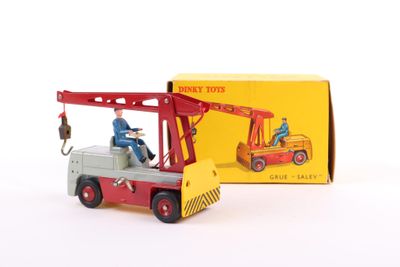 a toy truck with a man on it and a box behind it