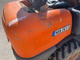 a close up of an orange tractor with a number plate on it
