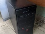 a small desktop computer sitting on top of a wooden desk