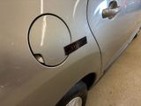 a close up of a car door handle with a sticker on it