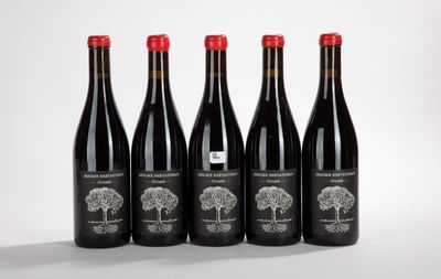 four bottles of red wine sitting on top of a table