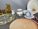 a lot of plates and cups on the table