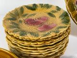 a lot of plates and bowls that are sitting on a table