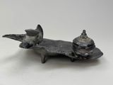 sculpture of a bird on a plate with a bird on top of it