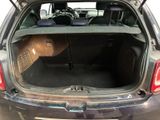 the back of a car with its trunk open and the back seats folded down