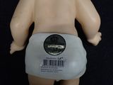 a baby doll with a diaper on it ' s back