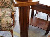 an image of a living room with a chair and a table