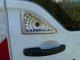 a close up of a door handle on a white car