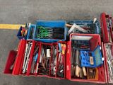 a lot of tools in a red box on the ground