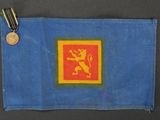 a blue and yellow flag with a lion on it and a medal