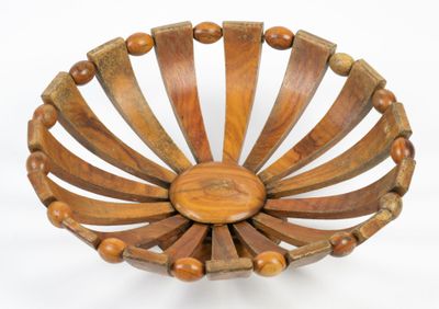 a wooden bowl that has wooden beads on it