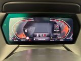 the dashboard of a car with a digital display in the center of it