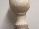 a white sculpture of a mushroom on top of a table