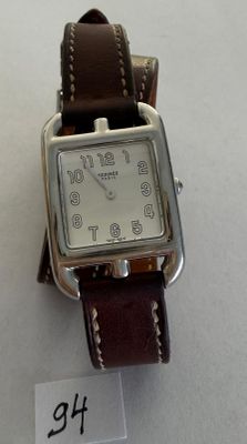 a watch that is sitting on a table with a price tag