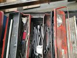 a lot of tools in a tool box on the floor