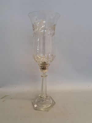 a wine glass sitting on a table with a white background