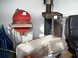a wheelbarrow in the middle of a room with a fire hydrant in the background
