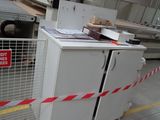 a picture of a machine that is cutting a piece of wood