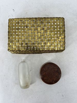 an image of a small gold purse next to a penny