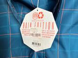 a close up of a blue jacket with a tag on it