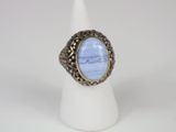a silver ring with a blue stone in the center