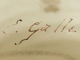 a close up of a vase with writing on it