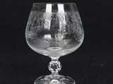 a close up of a wine glass on a black background