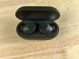 a close up of a pair of earphones in a case on a table