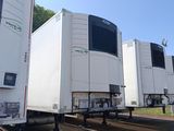 many trucks that are lined up in a parking lot