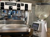 a coffee machine and a blender sitting on a table