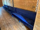 a blue couch in the middle of a room