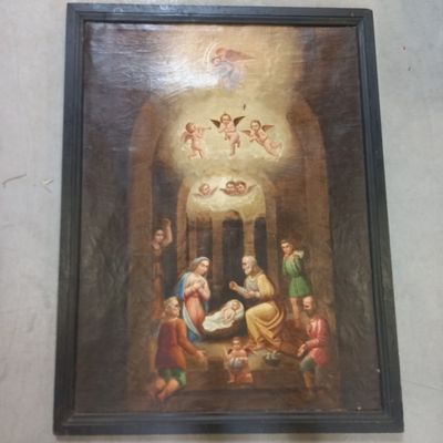 une peinture à l'huile représentant une crèche avec des anges et une mangeoire