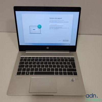 the laptop is open on the table with the screen on