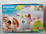 a box of playmobil color crayon crayons and a crayon set