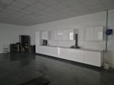 an image of a kitchen with white cabinets and appliances