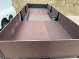 a truck bed that is sitting on the side of the road