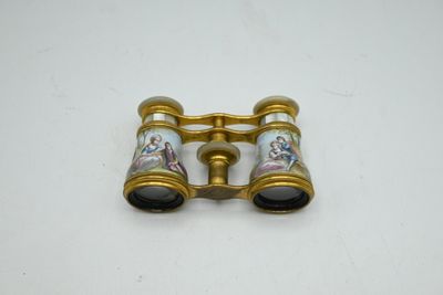 a close up of a pair of binoculars on a white surface