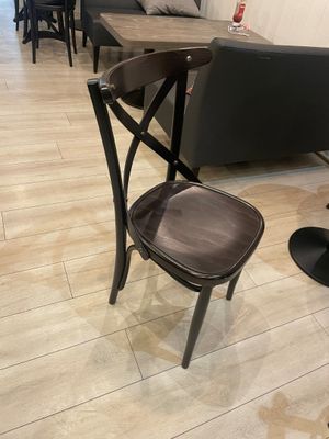 a chair and a table in a room with wood flooring