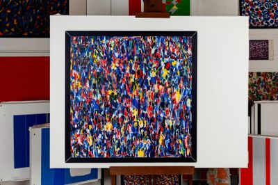 a picture of a painting on a easel in a room