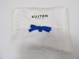 a close up of a white pillow with a blue bow on it