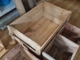 two wooden crates sitting on the floor next to each other