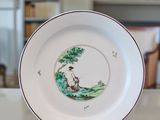 a plate that has a picture of a bear on it